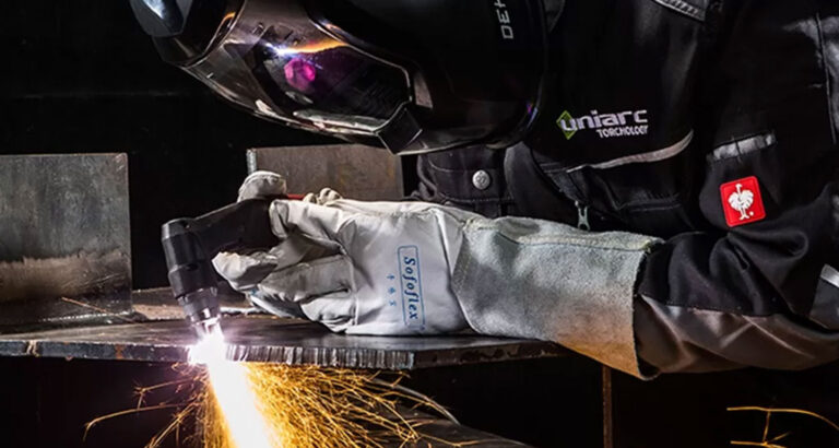 A man grinding by wearing uniarc welding and grinding jacket